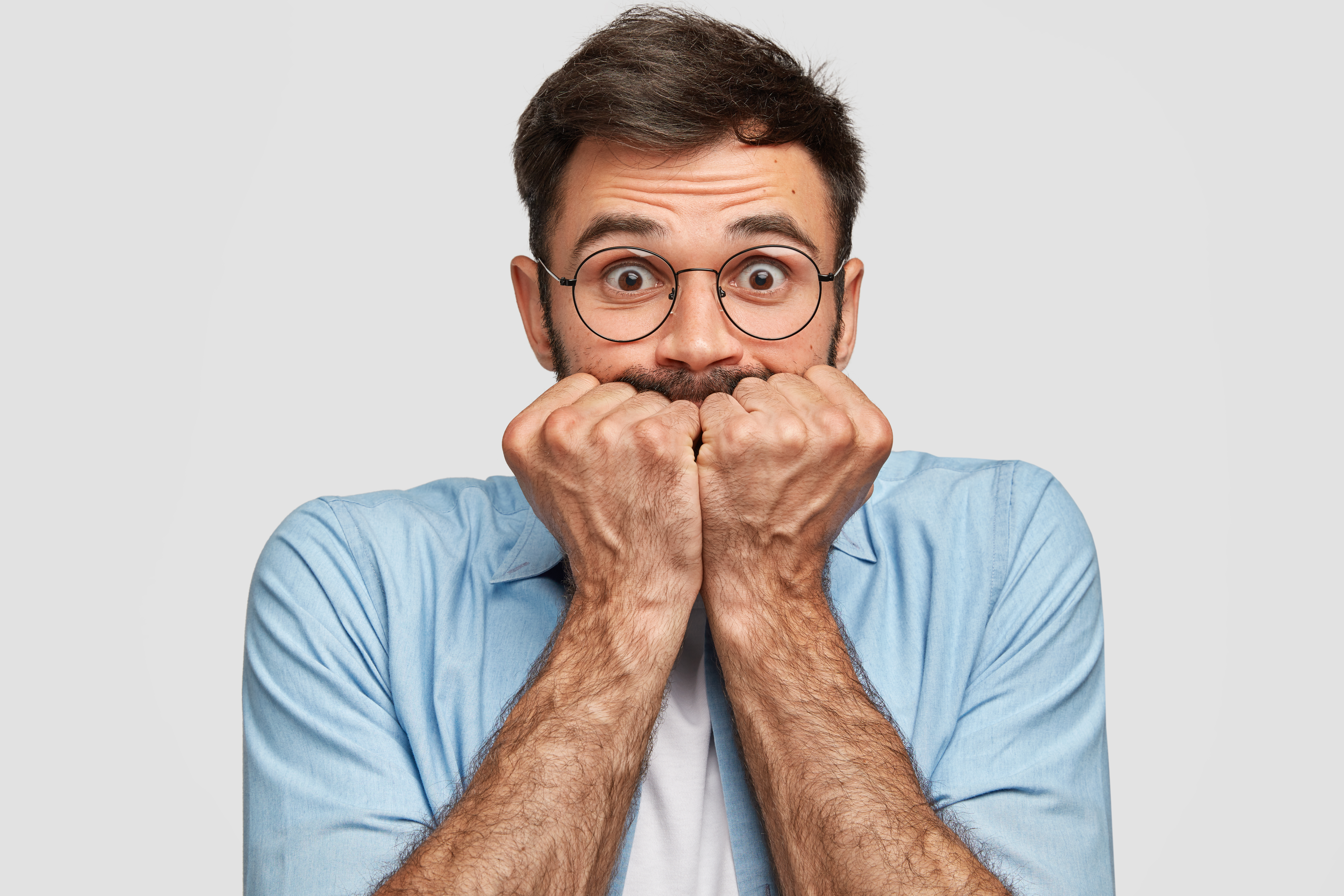 Nervous Frightened Male Keeps Fists Near Mouth, Has Worried Expression, Stares At Camera, Isolated Over White Background. Axious Unshaven Young Man Feels Depressed. People And Concern Concept - Notícias e Artigos Contábeis na Zona Leste - SP | Vance Contábil
